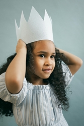 Black girl in paper crown on gray background by Monstera Production via Pexels.com.