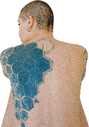 Woman with tattoo on her back by Anna Shvets via Pexels.com.